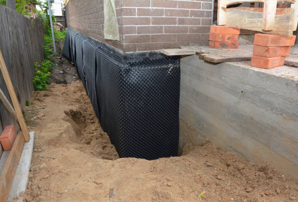 Happy homeowners after waterproofing job in Mosheim